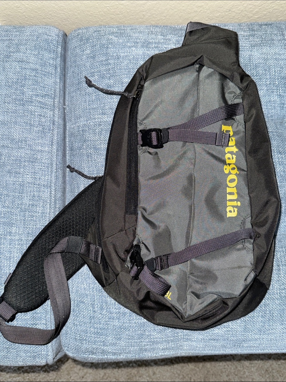 Patagonia Black and Gray Sling Bag with Yellow Logo